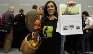 Greenpeace volunteers man the high profile 'Green my Apple' stall at the Mac Expo in Olympia, Kensington, London today, persuading Mac fans to challenge Apple and go green. The stall was later shut down at the start of the 3 day expo. The Greenpeace stall was bought to the three-day event in an attempt to raise awareness about concerns over the use of toxic chemicals in Apple's products. ©2006Greenpeace/Will Rose 